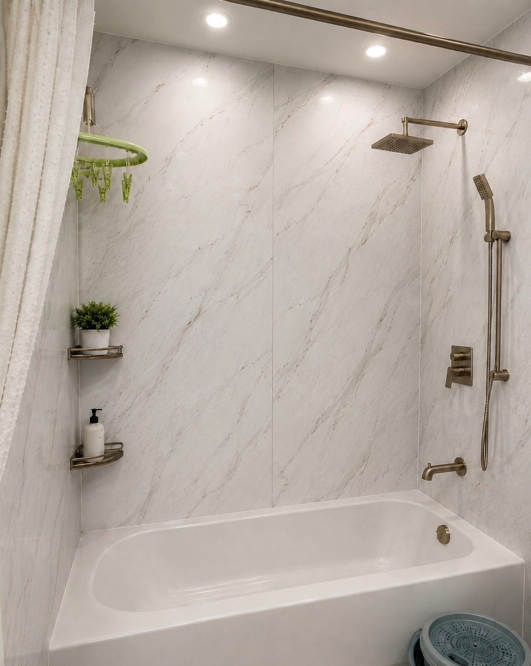 After — bathroom refreshed with marble-look waterproof wall panels, no demolition